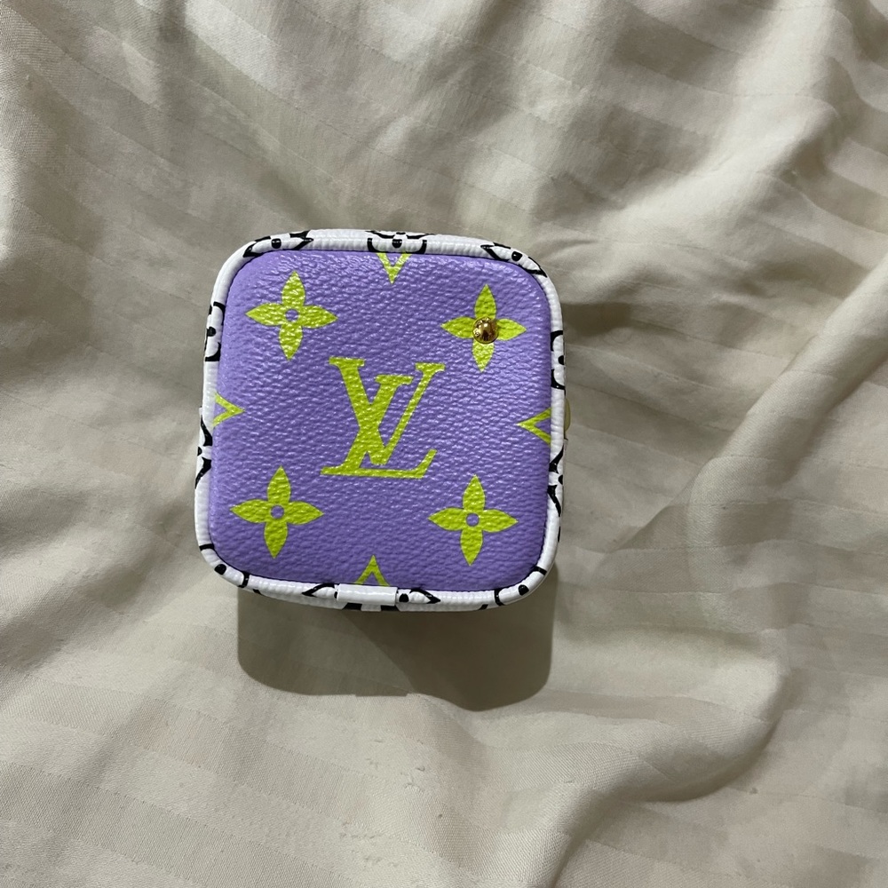 Louis Vuitton cube key holder accessory.
